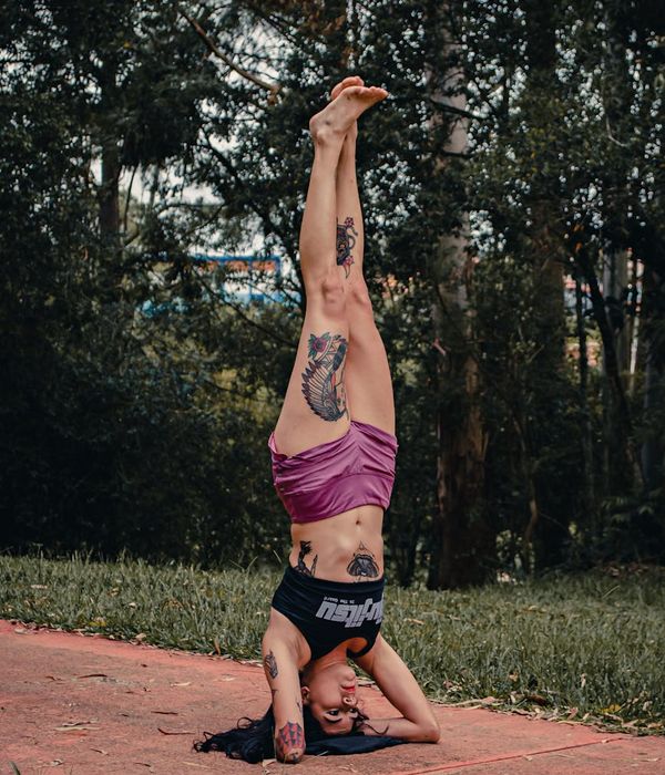 Man performing a controlled bodyweight exercise with focused expression.